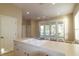 The bright kitchen is accented by a large island and breakfast bar at 5789 Lake Victoria Dr, Lakeland, FL 33813