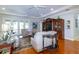 Bright living room featuring hardwood floors, a ceiling fan, and access to the outdoor patio at 5789 Lake Victoria Dr, Lakeland, FL 33813