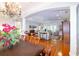 Open-concept living space with hardwood floors, and an adjacent dining room at 5789 Lake Victoria Dr, Lakeland, FL 33813