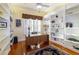 Well-lit office with custom built-in bookshelves and ample natural light at 5789 Lake Victoria Dr, Lakeland, FL 33813