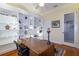 Comfortable office space featuring hardwood floors, built-in bookshelves, and a large window at 5789 Lake Victoria Dr, Lakeland, FL 33813