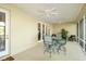 A covered patio with ceiling fans and outdoor furniture at 5789 Lake Victoria Dr, Lakeland, FL 33813