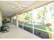 Spacious screened-in patio with outdoor seating and serene lake views at 5789 Lake Victoria Dr, Lakeland, FL 33813