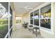 A covered patio with ceiling fans and multiple seating areas at 5789 Lake Victoria Dr, Lakeland, FL 33813