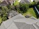 Aerial view of home with screened-in pool and lush landscaping at 6470 Ashley Dr, Lakeland, FL 33813