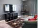 Cozy basement area featuring a TV, workspace and accent rug, perfect for relaxation or home office setup at 6470 Ashley Dr, Lakeland, FL 33813