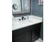 Modern bathroom featuring a black vanity with white countertop at 6470 Ashley Dr, Lakeland, FL 33813