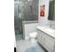 Bathroom with a modern vanity and a glass-enclosed shower at 6470 Ashley Dr, Lakeland, FL 33813