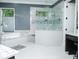 Beautiful bathroom featuring a glass shower and a separate soaking tub at 6470 Ashley Dr, Lakeland, FL 33813