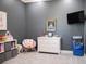 bedroom offers a comfortable space with neutral carpet and stylish decor at 6470 Ashley Dr, Lakeland, FL 33813