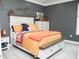 Comfortable bedroom with a beautifully dressed bed and stylish furnishings at 6470 Ashley Dr, Lakeland, FL 33813