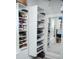 This walk-in closet has custom built-in shelves, drawers, and cabinets for optimum organization at 6470 Ashley Dr, Lakeland, FL 33813