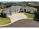Stunning single-story home featuring a circular driveway and a three-car garage at 6470 Ashley Dr, Lakeland, FL 33813