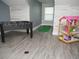 Game room featuring a foosball table, putting green, and dollhouse at 6470 Ashley Dr, Lakeland, FL 33813