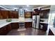 Well-appointed kitchen featuring stainless steel appliances, dark wood cabinets, and contemporary design elements at 6470 Ashley Dr, Lakeland, FL 33813
