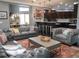 Stylish living room seamlessly connecting to the kitchen, featuring dark floors and luxurious seating at 6470 Ashley Dr, Lakeland, FL 33813