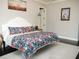 Calming bedroom with decorative painting, dark hardwood floors, and ample natural light at 6470 Ashley Dr, Lakeland, FL 33813