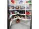 Organized walk-in pantry with ample shelving, providing plenty of storage space for food and kitchen essentials at 6470 Ashley Dr, Lakeland, FL 33813