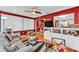 Bright sunroom with access to the kitchen, white built-in shelving, and neutral color palette at 6725 Trail Ridge Dr, Lakeland, FL 33813