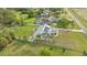 Sprawling residence surrounded by lush greenery, complemented by the home's metal roof and solar panels at 6745 Old Melbourne Hwy, St Cloud, FL 34771