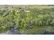 Aerial view showcasing a lakefront property with private boat docks at 6745 Old Melbourne Hwy, St Cloud, FL 34771