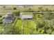 Aerial view of a home with green lawn and winding backyard path at 6745 Old Melbourne Hwy, St Cloud, FL 34771