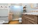 Well-appointed bathroom with glass shower enclosure and decorative shelving at 6745 Old Melbourne Hwy, St Cloud, FL 34771