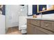 Stylish bathroom features a glass-enclosed shower and modern vanity with granite counters at 6745 Old Melbourne Hwy, St Cloud, FL 34771