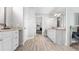 Bright, spacious bathroom with white cabinets, granite countertops, and a view of the walk-in closet at 6745 Old Melbourne Hwy, St Cloud, FL 34771