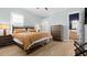 Bedroom with wood floors, neutral walls, and ensuite bathroom access at 6745 Old Melbourne Hwy, St Cloud, FL 34771