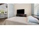 Relaxing bedroom featuring natural light, tv and neutral color palette at 6745 Old Melbourne Hwy, St Cloud, FL 34771