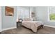 Light-filled bedroom with a soothing color palette and stylish decor at 6745 Old Melbourne Hwy, St Cloud, FL 34771