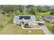 Stunning single-story home with well-manicured lawn, solar panels, and inviting entrance at 6745 Old Melbourne Hwy, St Cloud, FL 34771