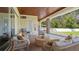 Inviting covered patio featuring comfortable seating and a view of the backyard at 6745 Old Melbourne Hwy, St Cloud, FL 34771