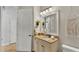 Bathroom vanity with granite countertop and decorative plants at 6774 Crescent Woods Cir, Lakeland, FL 33813