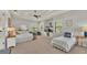 Spacious bedroom featuring two beds, neutral walls, and ceiling fan at 6774 Crescent Woods Cir, Lakeland, FL 33813