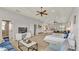 Spacious, light-filled bedroom with seating area and multiple beds at 6774 Crescent Woods Cir, Lakeland, FL 33813