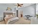 Bedroom featuring a ceiling fan, connected bath and simple design at 6774 Crescent Woods Cir, Lakeland, FL 33813