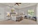 Bedroom featuring a queen bed, neutral walls, ceiling fan, and simple décor at 6774 Crescent Woods Cir, Lakeland, FL 33813