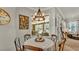 Cozy breakfast nook features a round table, pendant lighting, and a view of the outdoor patio at 6774 Crescent Woods Cir, Lakeland, FL 33813