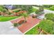 Gated community entrance with brick accents, landscaping, and a sign atop a brick planter at 6774 Crescent Woods Cir, Lakeland, FL 33813