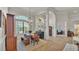 Elegant dining room featuring a chandelier, large windows, and views into the living spaces at 6774 Crescent Woods Cir, Lakeland, FL 33813
