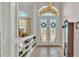 Grand entryway boasting tile floors, a decorative door, and a built-in display case at 6774 Crescent Woods Cir, Lakeland, FL 33813