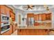 Well-equipped kitchen with stainless steel appliances, granite countertops, and custom cabinetry at 6774 Crescent Woods Cir, Lakeland, FL 33813