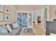 Cozy living room featuring a bookcase and comfortable sofa seating at 6774 Crescent Woods Cir, Lakeland, FL 33813
