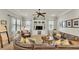 Cozy living room with built-in shelving, comfortable sectional sofa, and neutral color palette at 6774 Crescent Woods Cir, Lakeland, FL 33813