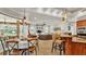 Spacious living room featuring an open floor plan with a bar, comfortable seating, and natural light at 6774 Crescent Woods Cir, Lakeland, FL 33813
