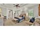 Spacious main bedroom featuring a tray ceiling, fan, and neutral decor at 6774 Crescent Woods Cir, Lakeland, FL 33813