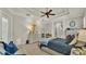 Bright main bedroom featuring a tray ceiling, fan, neutral colors, and ample space at 6774 Crescent Woods Cir, Lakeland, FL 33813
