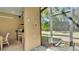 A convenient outdoor kitchen and grilling area are steps away from the pool at 6774 Crescent Woods Cir, Lakeland, FL 33813